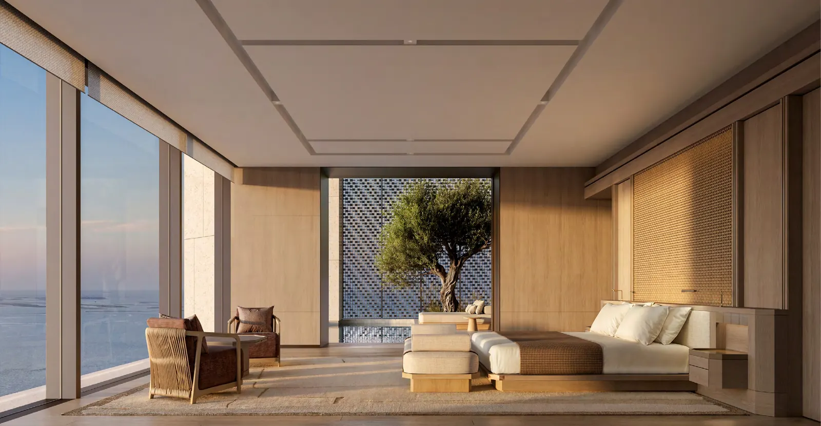 Primary bedroom with ocean views and an olive tree framed by a screened terrace
