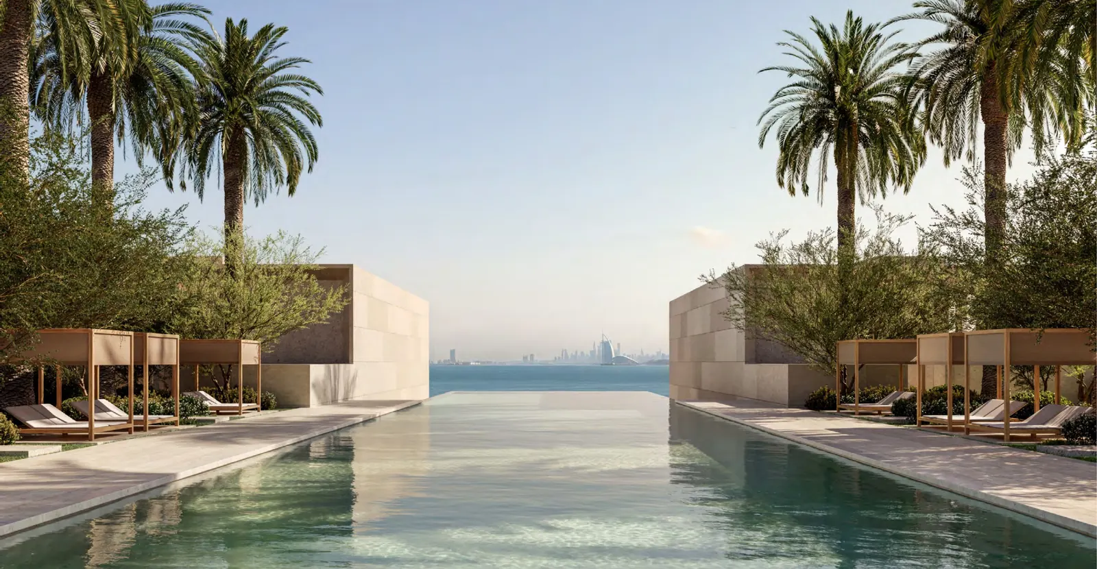 The 50-metre residents' swimming pool flanked by palms, looking out to the Gulf and Burj Al Arab