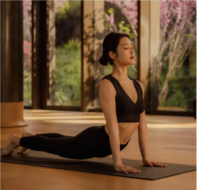 Movement practice in a light-filled studio at Aman Spa